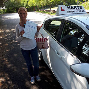 Woman holding a certificate in Chesterfield.