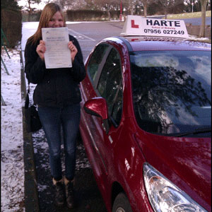 Very shy woman holding first time pass cetificate in Chesterfield.